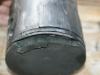 piston exhibits detonation and dome fracture with adhesive scoring to skirt